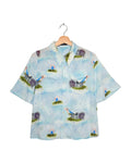 Undercover 2022SS All My Colours watercolour print shirt - front view on hanger, boxy short sleeve with painterly watercolour motif