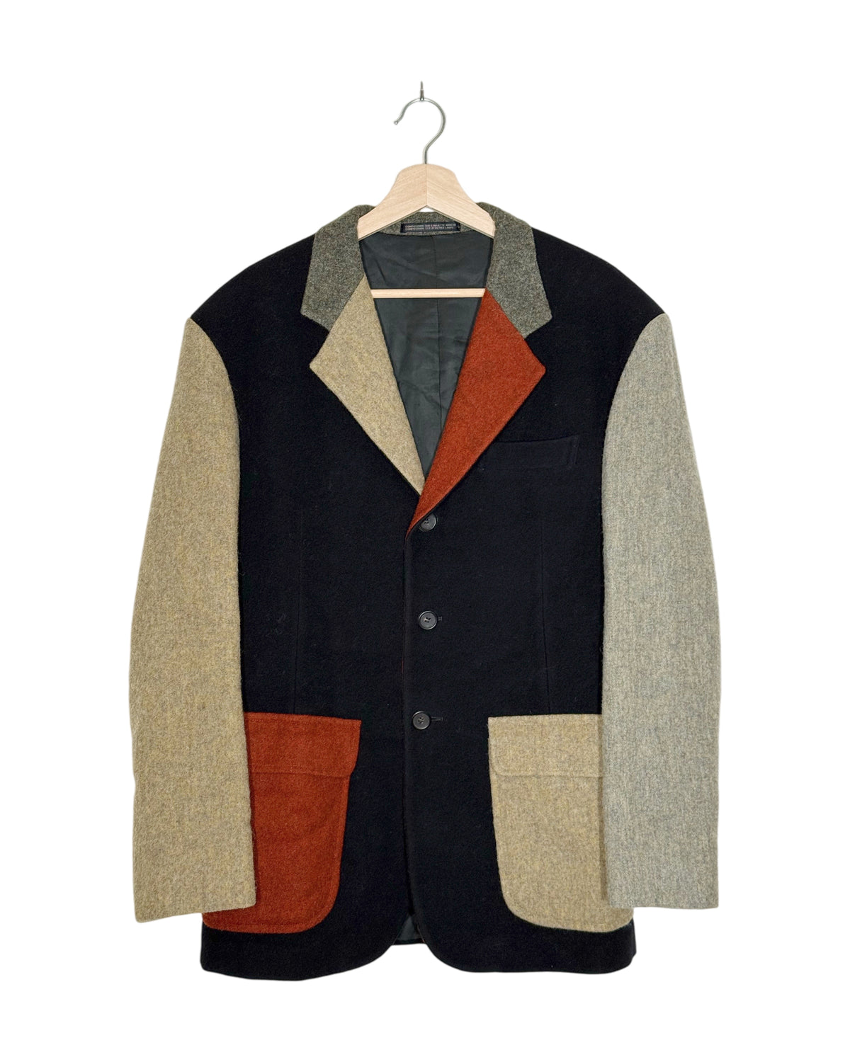 Yohji Yamamoto Pour Homme 1990AW Runway Color-Block Wool Blazer - front view on hanger, dense wool in a relaxed cut with vivid colour blocks on a black body