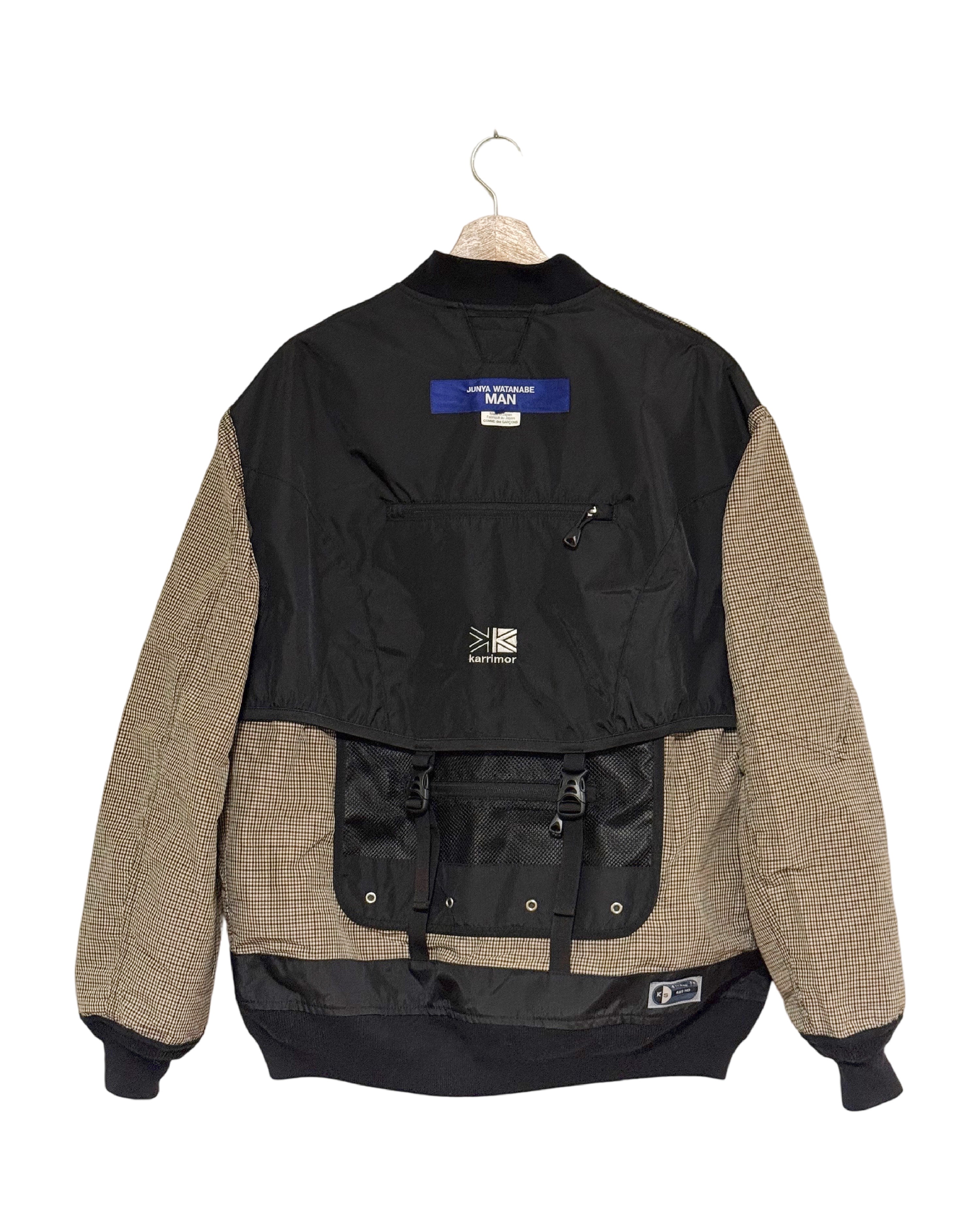 Karrimor x Junya Watanabe MAN 2022SS reversible bomber jacket - back view on hanger, MA-1 bomber reversing to a Karrimor