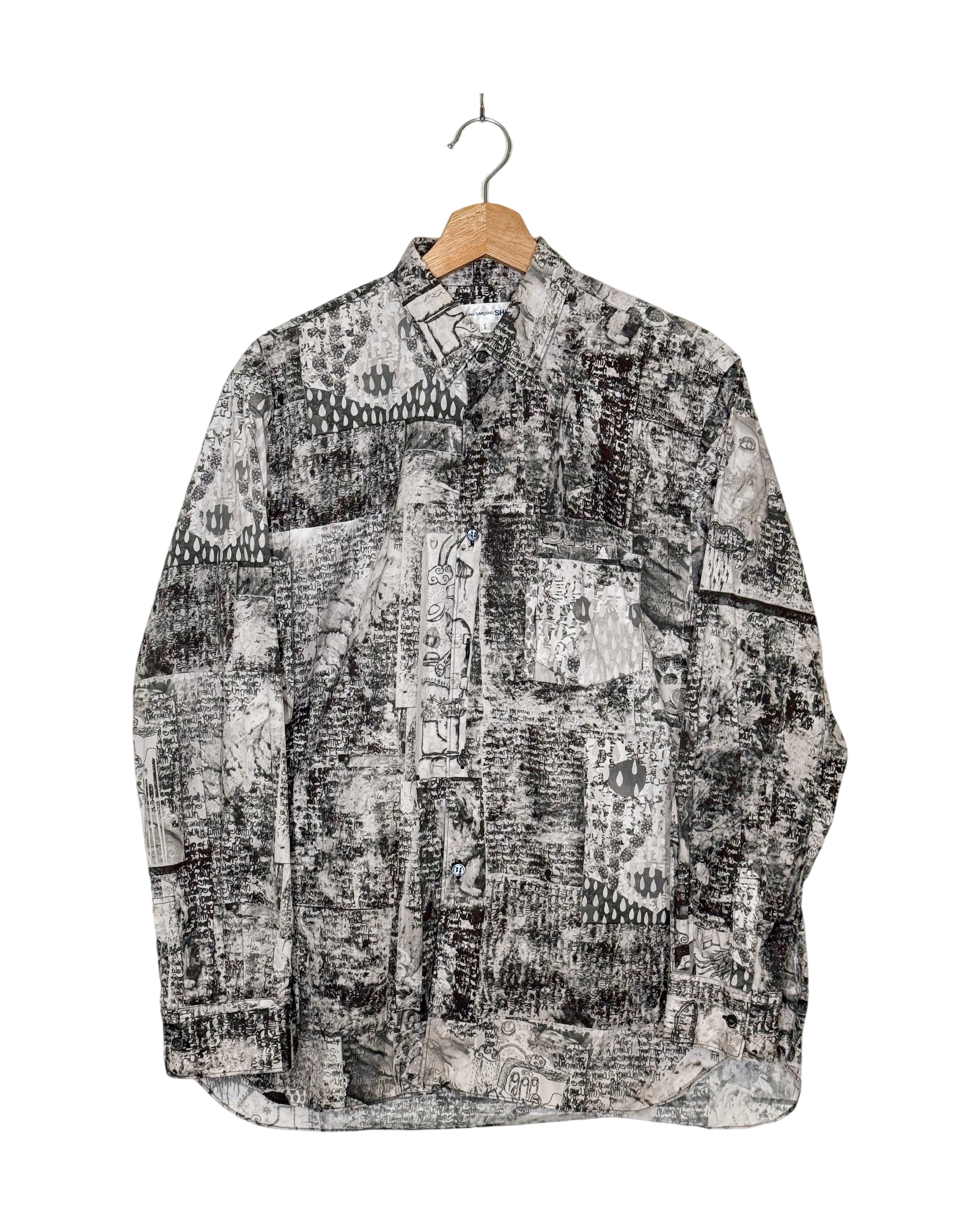 Comme des Garcons Shirt 2023SS Brett Westfall graffiti cut-out shirt - front view on hanger, dense monochrome ink collage