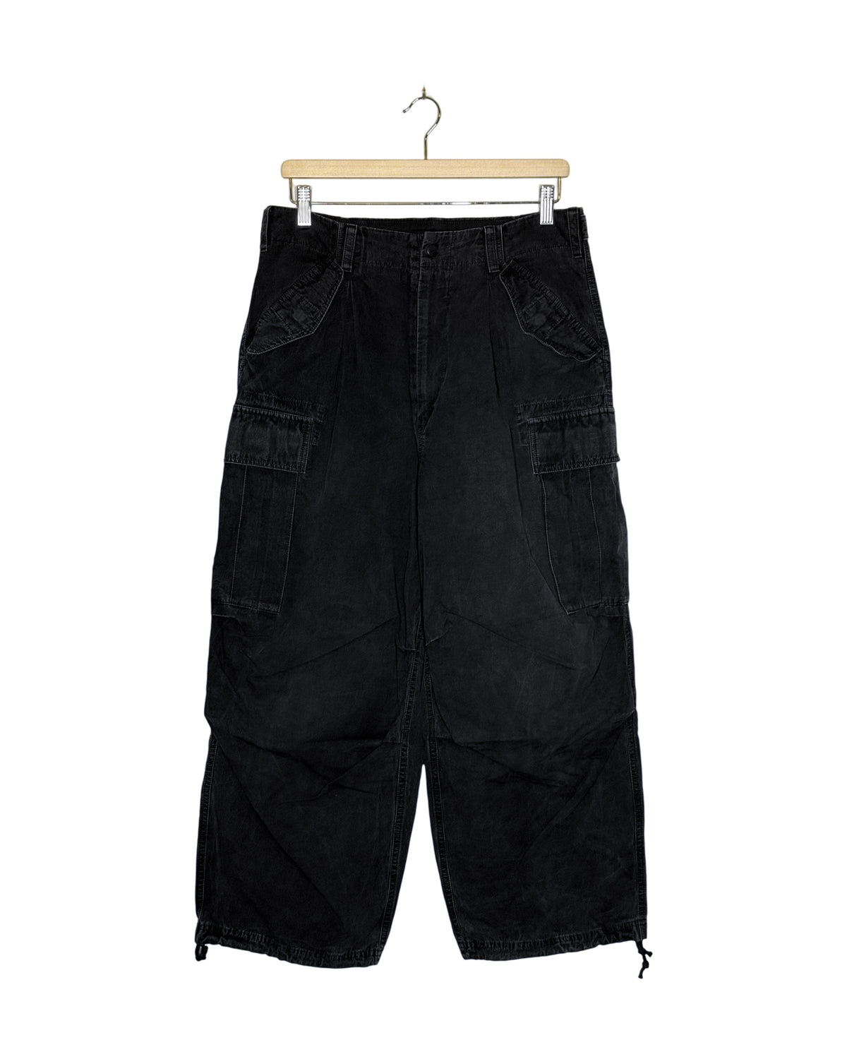 Yohji Yamamoto Pour Homme 2018AW washed distressed M51 military trousers - front view on hanger, M51 field pattern garment-washed to a faded black, drawcord hem