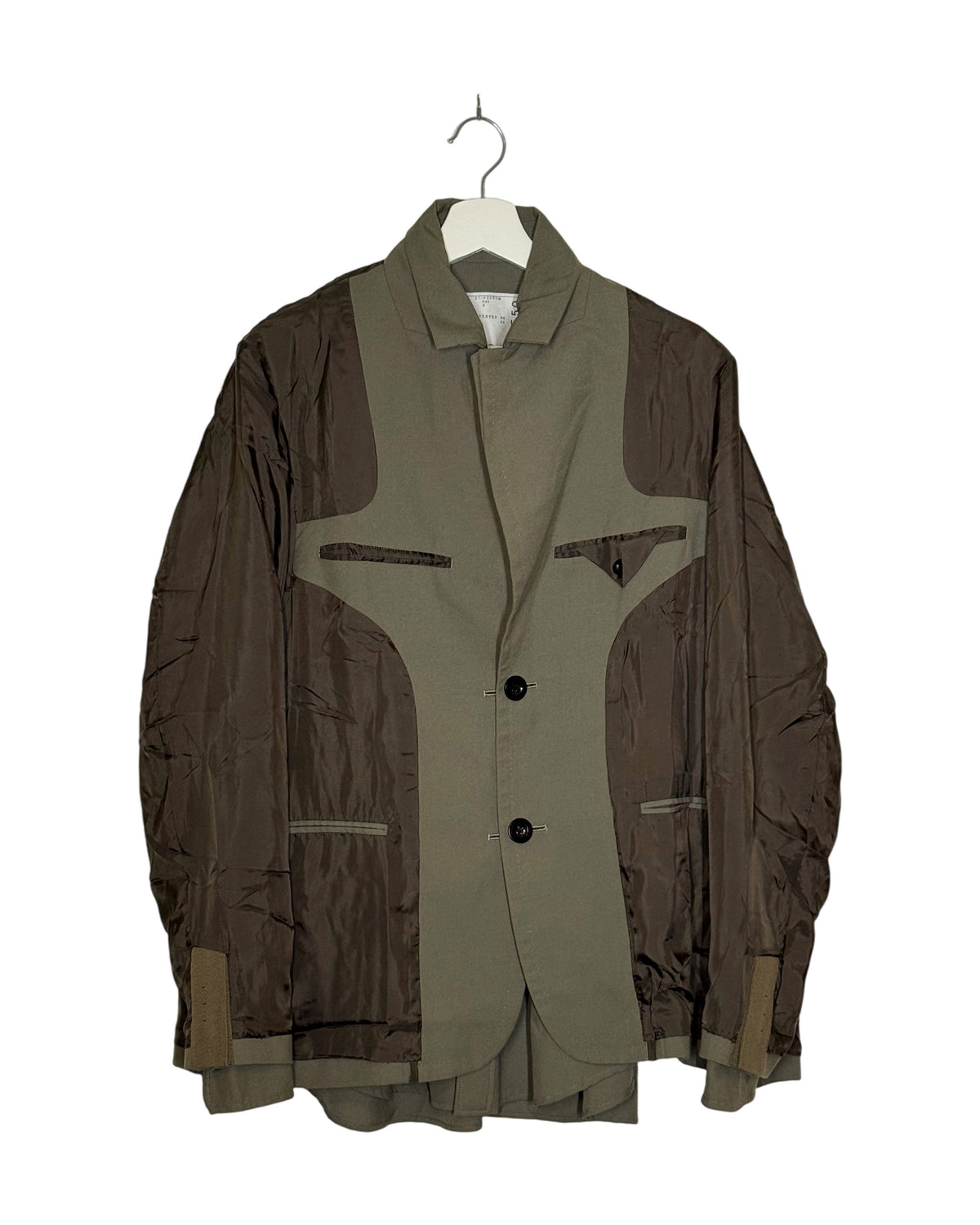 Sacai 2021AW double-layer reversible blazer - front view on hanger, two tailored bodies bonded back to back, army green over brown, wearable either face out